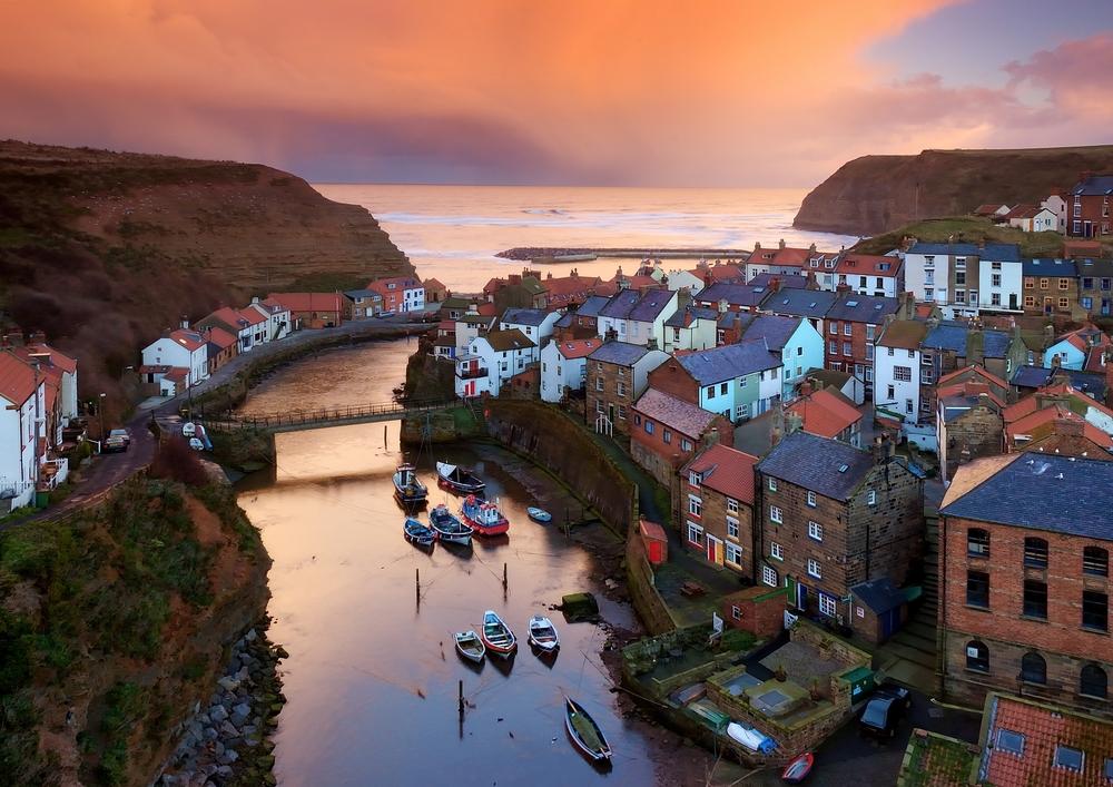 Staithes is a jumble of whitewashed, pantile-roofed cottages clinging to the hillside