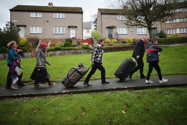 Syrian refugees arrive at their new home in Scotland in 2015