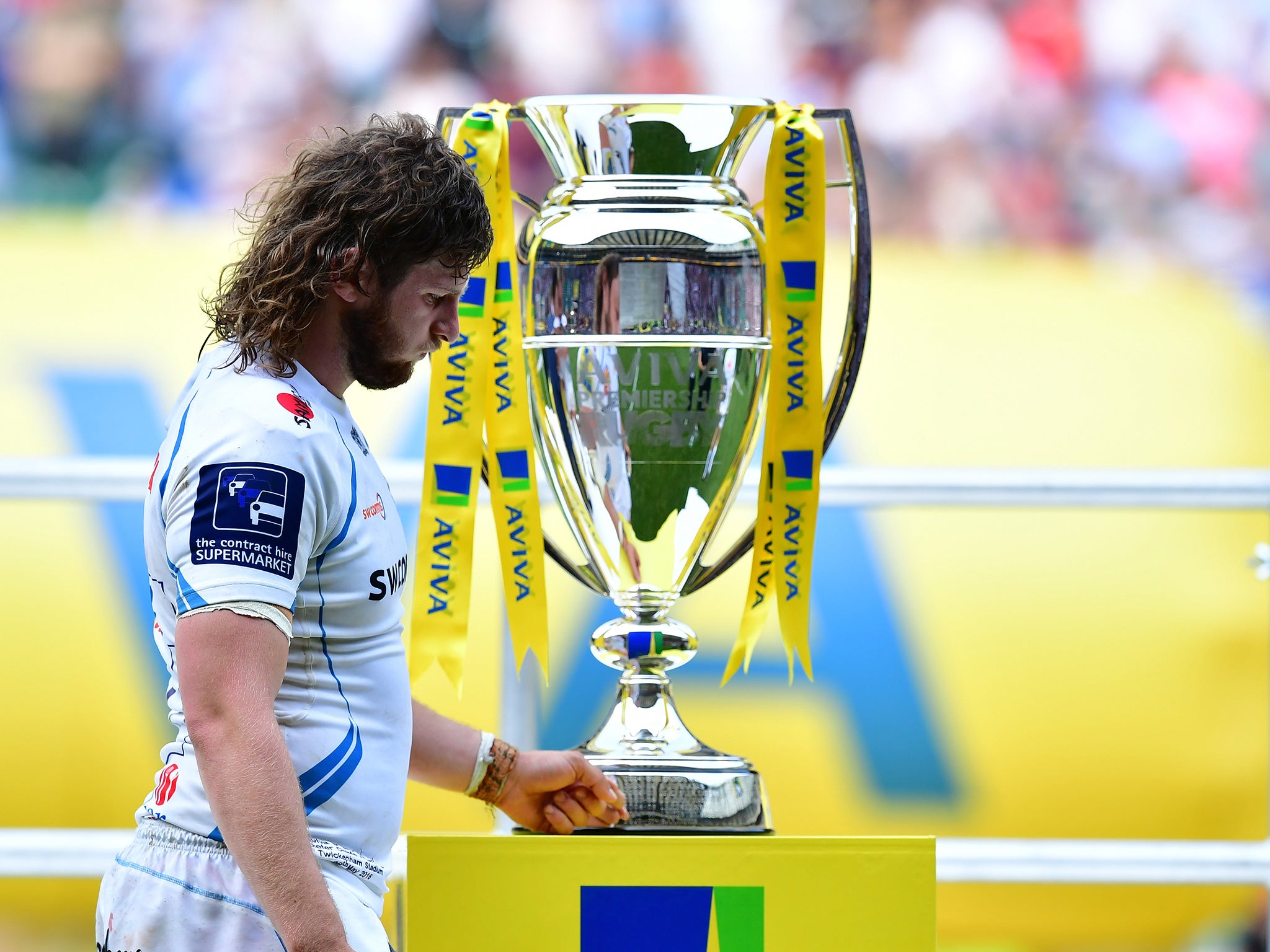 Hepburn passes the Premiership trophy after last year's final defeat to Saracens