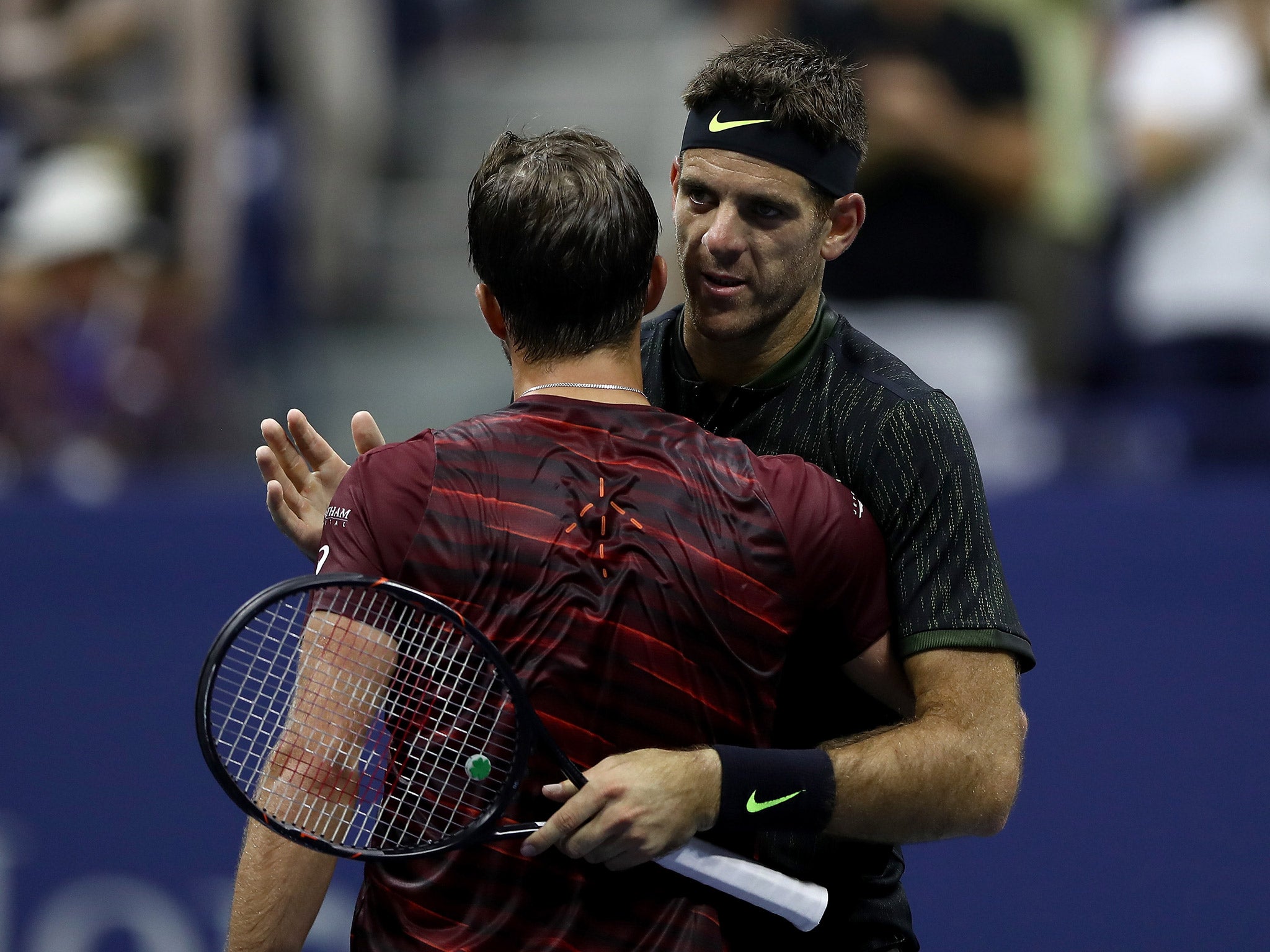 Del Potro embraces Johnson after their second round encounter