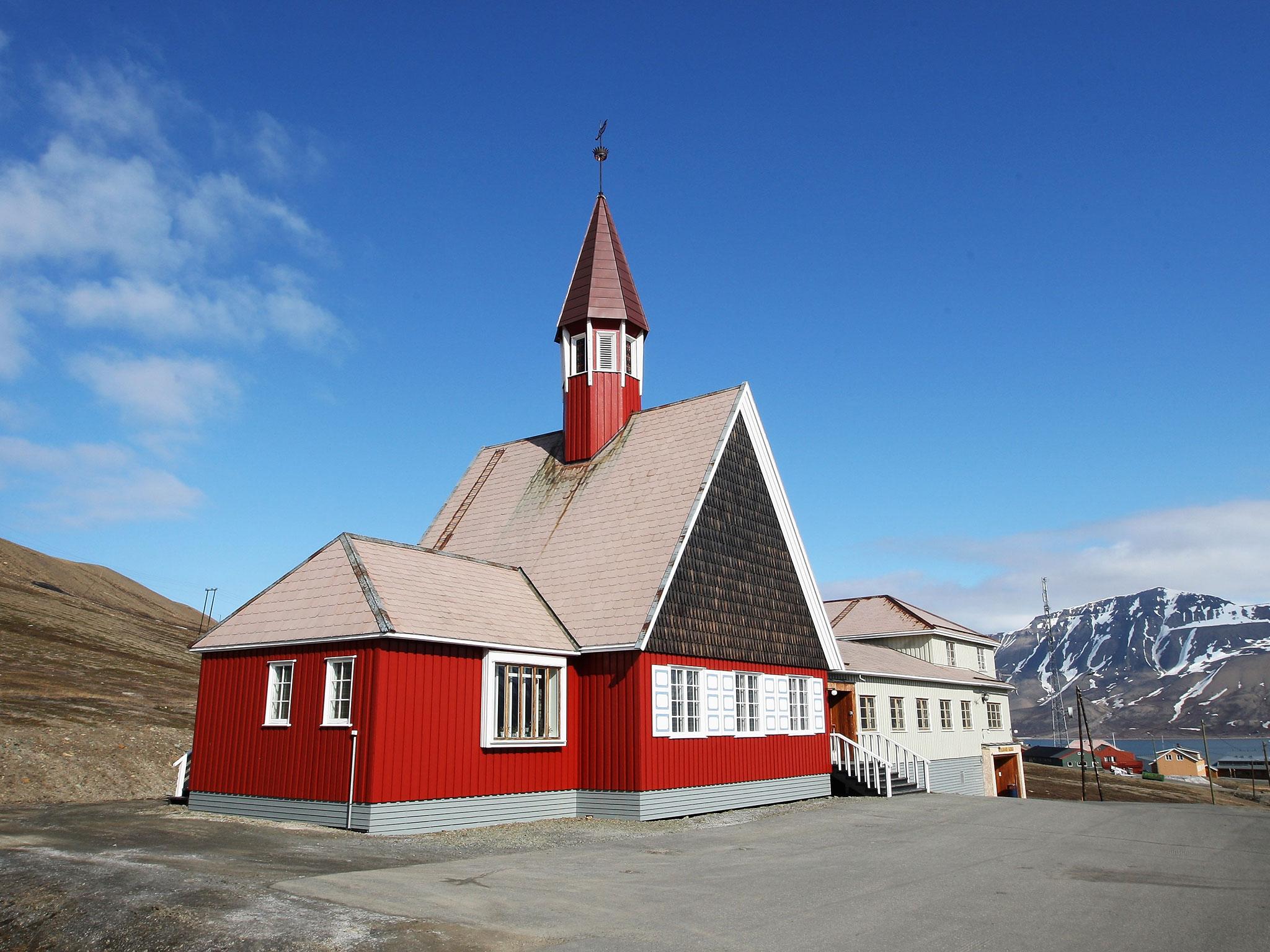The worlds's northernmost church stands overlooking the town of Longyearbyen in Longyearbyen, Norway