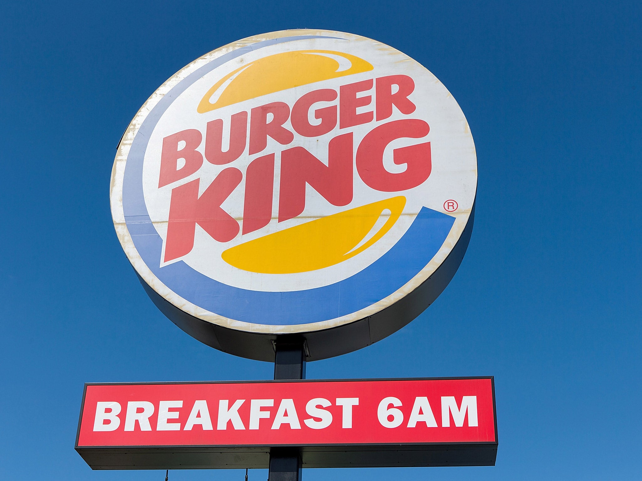 The owner of Burger King said it intends to apply the new policy to all brands over time