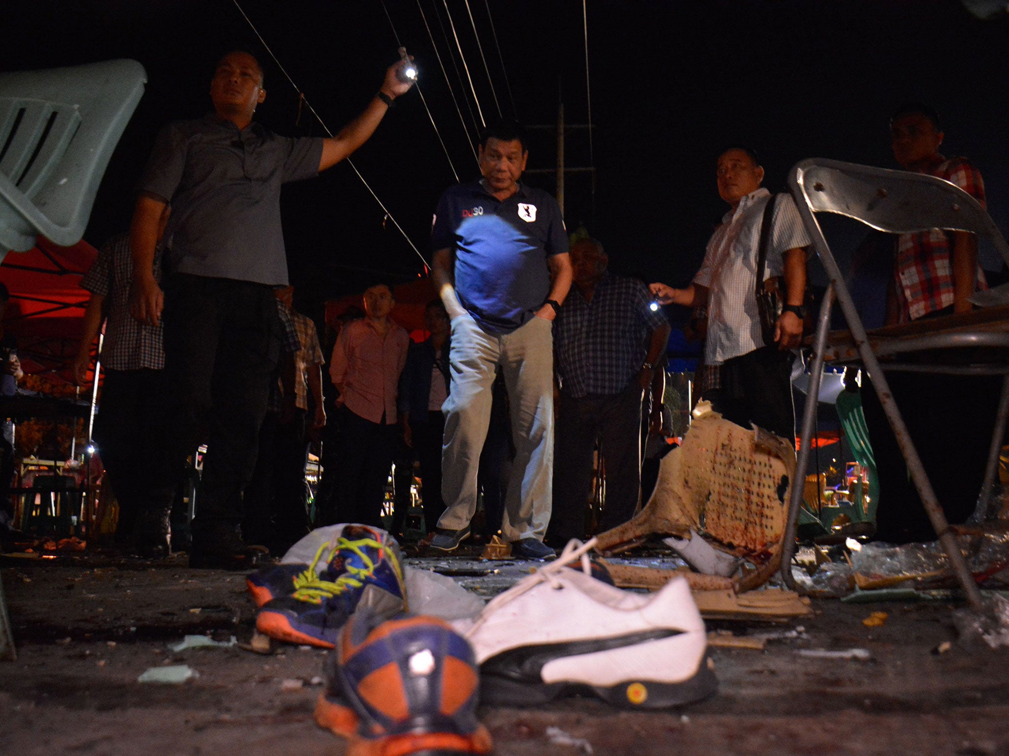 President Rodrigo R. Duterte inspecting the site of a bomb blast at the night market in Davao City on 2 September