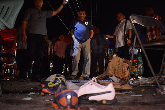 President Rodrigo R. Duterte inspecting the site of a bomb blast at the night market in Davao City on 2 September