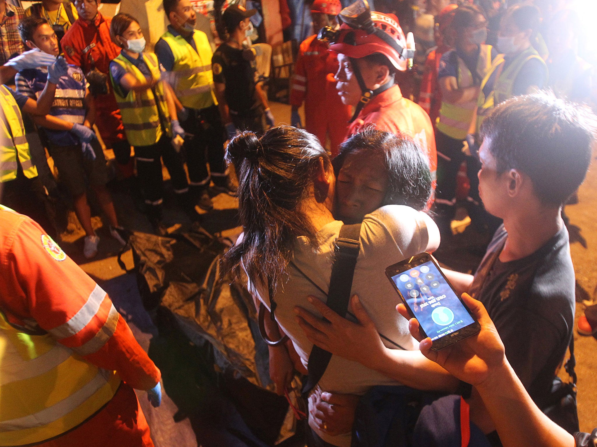 A woman cries in front of a body bag after an explosion at a market in Davao City, Philippines September 3,