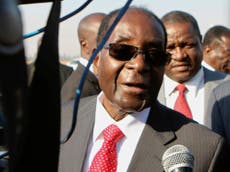 Robert Mugabe arrives back in Zimbabwe after health scare and jokes 'Yes, it's true, I was dead'
