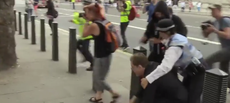 Watch police wrestle man to the ground for stealing Eddie Izzard’s hat at a pro-EU march