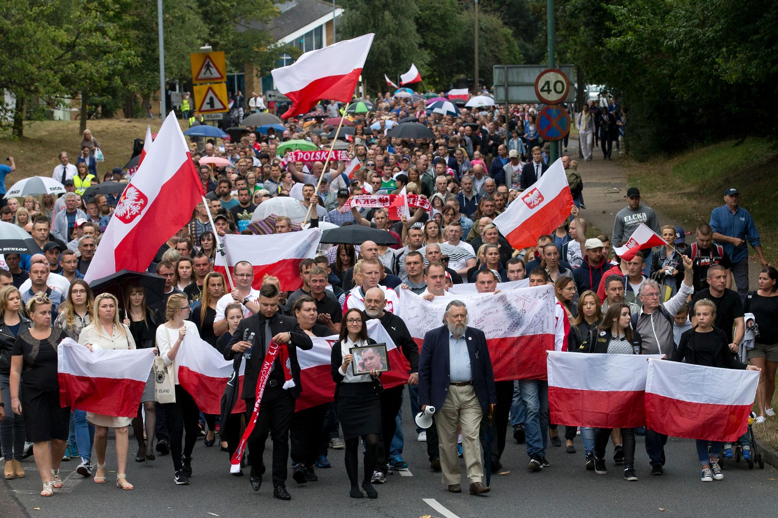 Hundreds of local residents in Harlow, Essex marched in support of the Polish community after a man was killed in hate crime attack