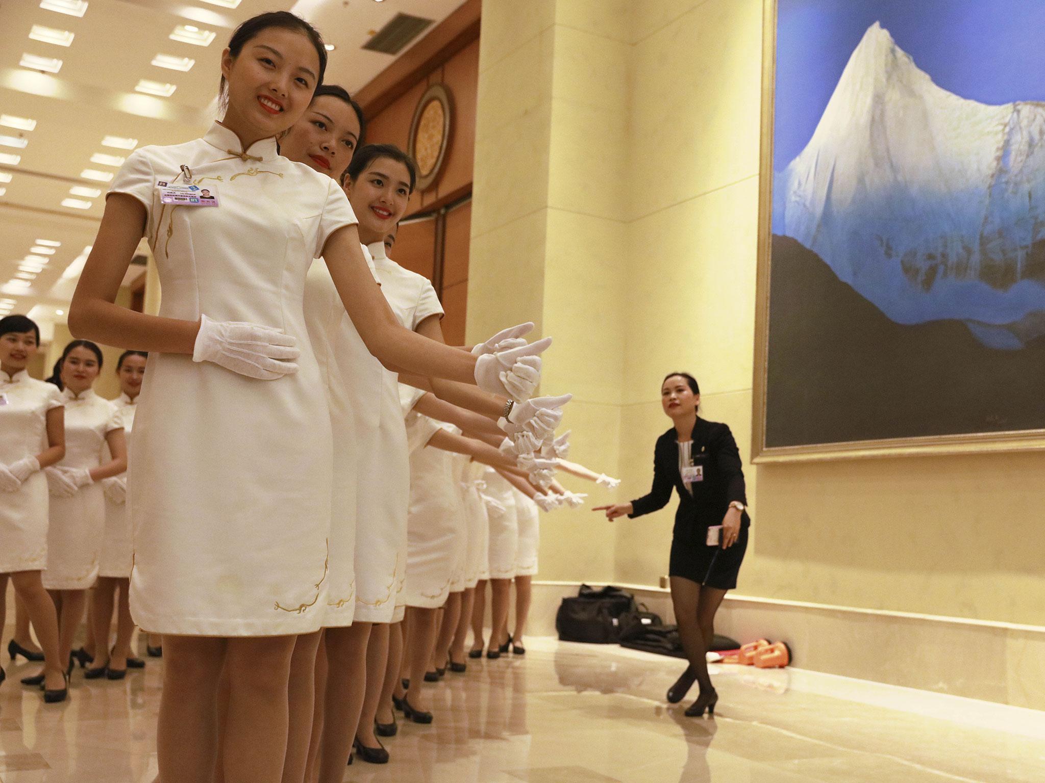 Chinese hostesses prepare for the arrival of world leaders and their staff at the G20 summit