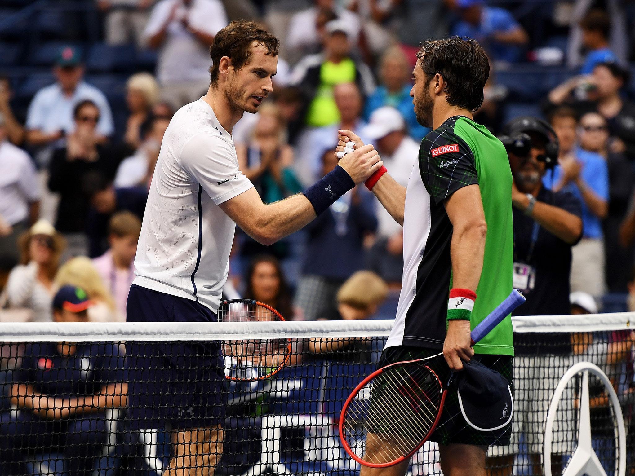 Andy Murray (left) beat Italy's Paolo Lorenzi 7-6 5-7 6-2 6-3 to reach the fourth round