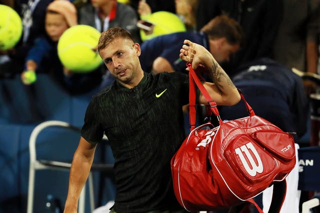 Dan Evans leaves the Louis Armstrong Stadium after his narrow defeat by Stan Wawrinka
