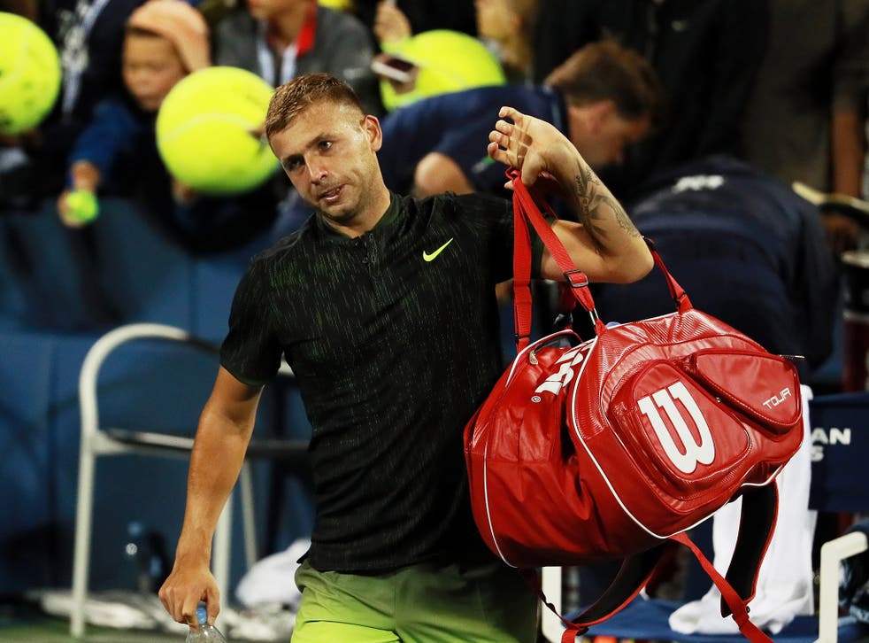 Dan Evans leaves the Louis Armstrong Stadium after his narrow defeat by Stan Wawrinka