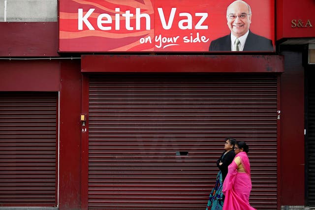 Women pass the Leicester East constituency office of Keith Vaz today. In almost three decades as the Hon. Member, he has proved himself 'a gifted self-publicist'