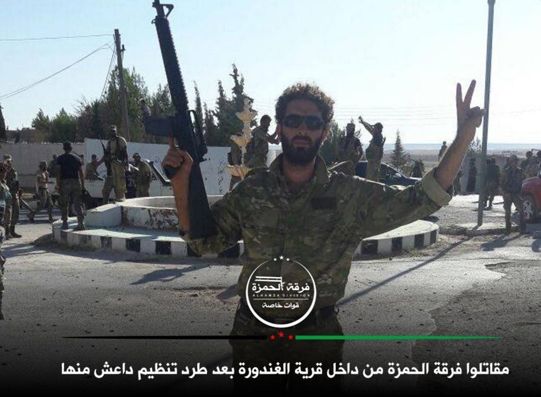 Free Syrian Army fighters at a roundabout in Al-Ganhurah, reportedly ending three years of Isis occupation