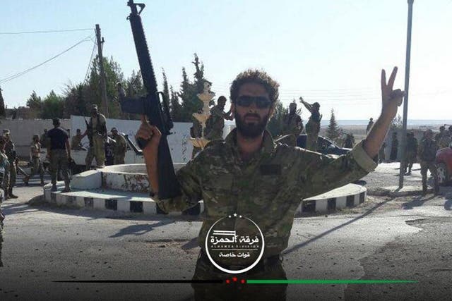 Free Syrian Army fighters at a roundabout in Al-Ganhurah, reportedly ending three years of Isis occupation