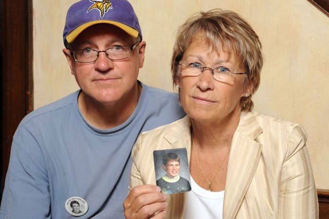 Patty and Jerry Wetterling show a photo of their son Jacob Wetterling, who was abducted in October of 1989 in St. Joseph, Minneapolis