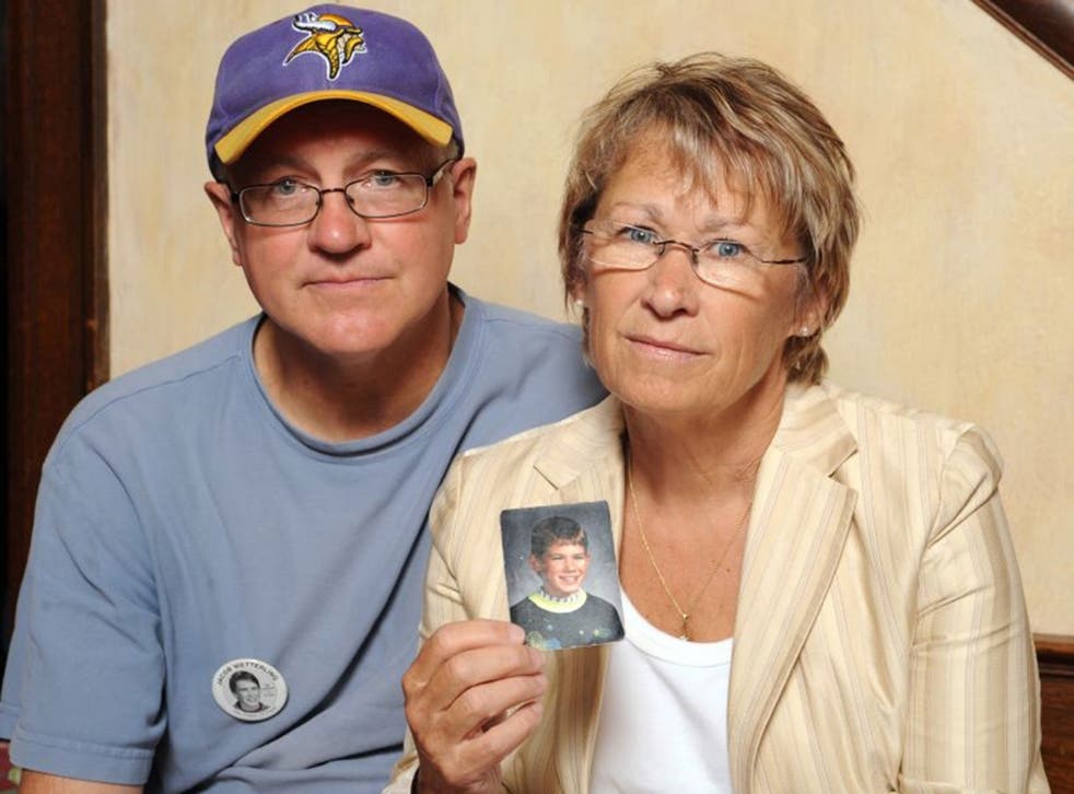 Patty and Jerry Wetterling show a photo of their son Jacob Wetterling, who was abducted in October of 1989 in St. Joseph, Minneapolis