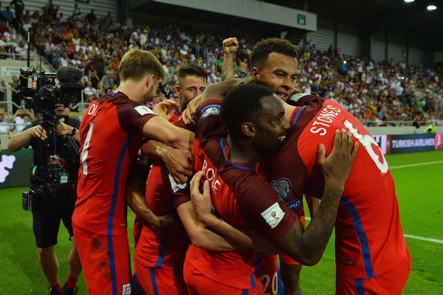 Adam Lallana is mobbed by his England team-mates after scoring a last-ditch winner