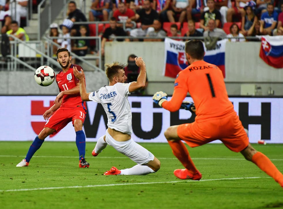 Adam Lallana takes a shot during the game against Slovakia