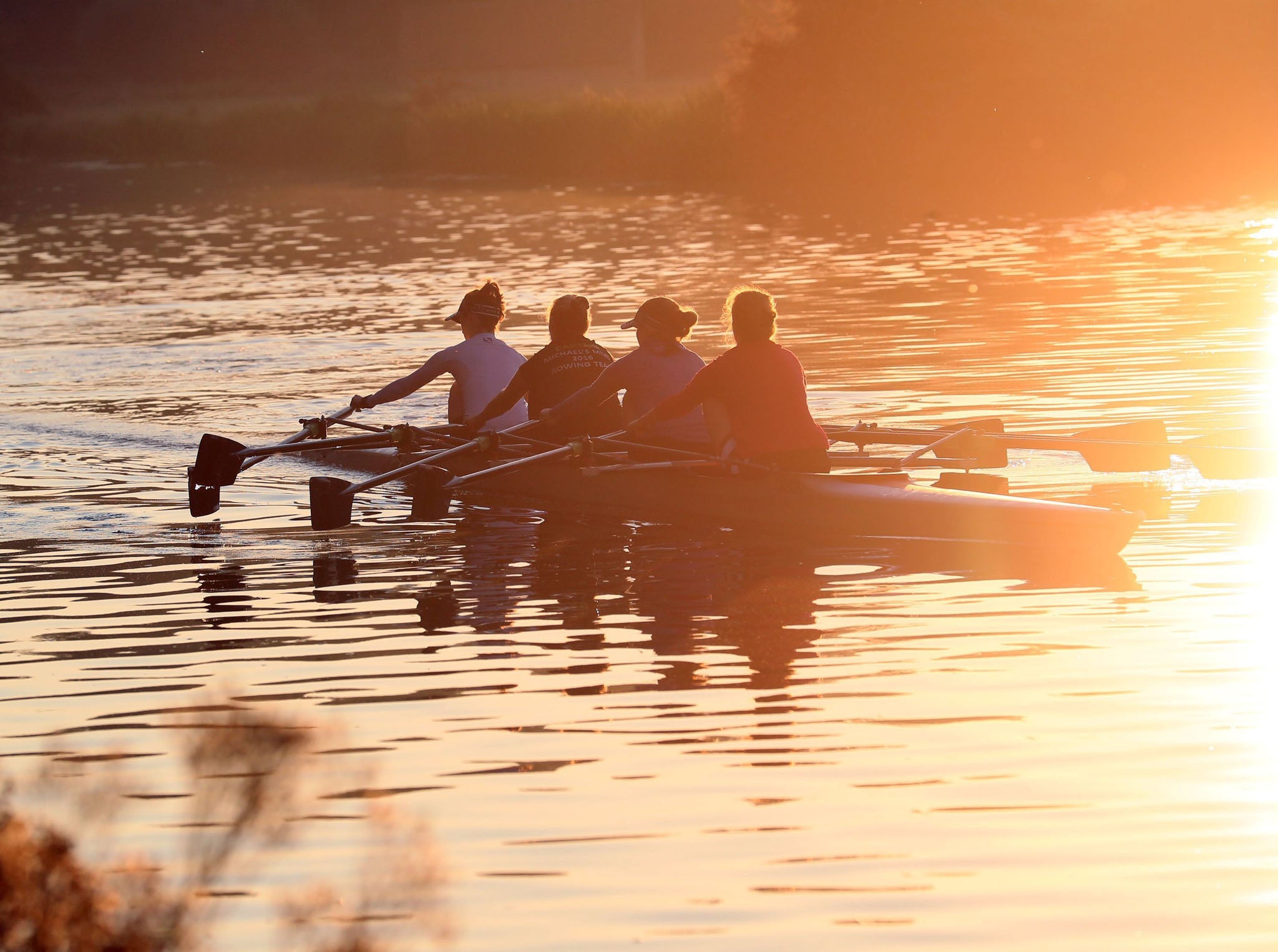 Rowers work out along the river Cam at sunrise in Cambridge, as the warm weather looks set to continue