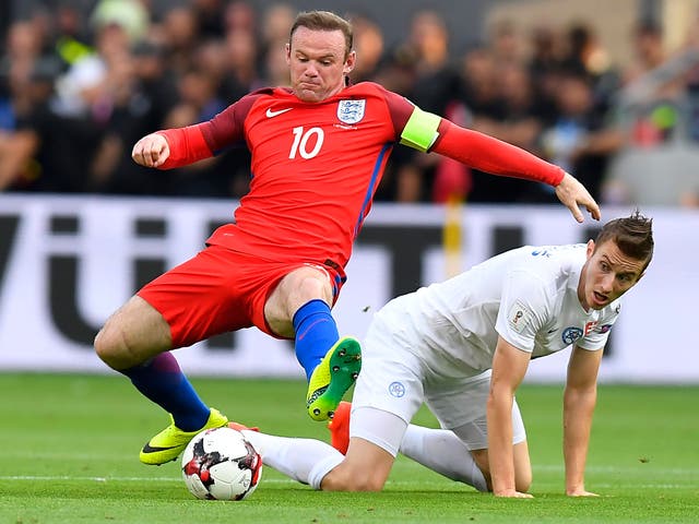 Instructions are issued to Wayne Rooney during the win over Slovakia