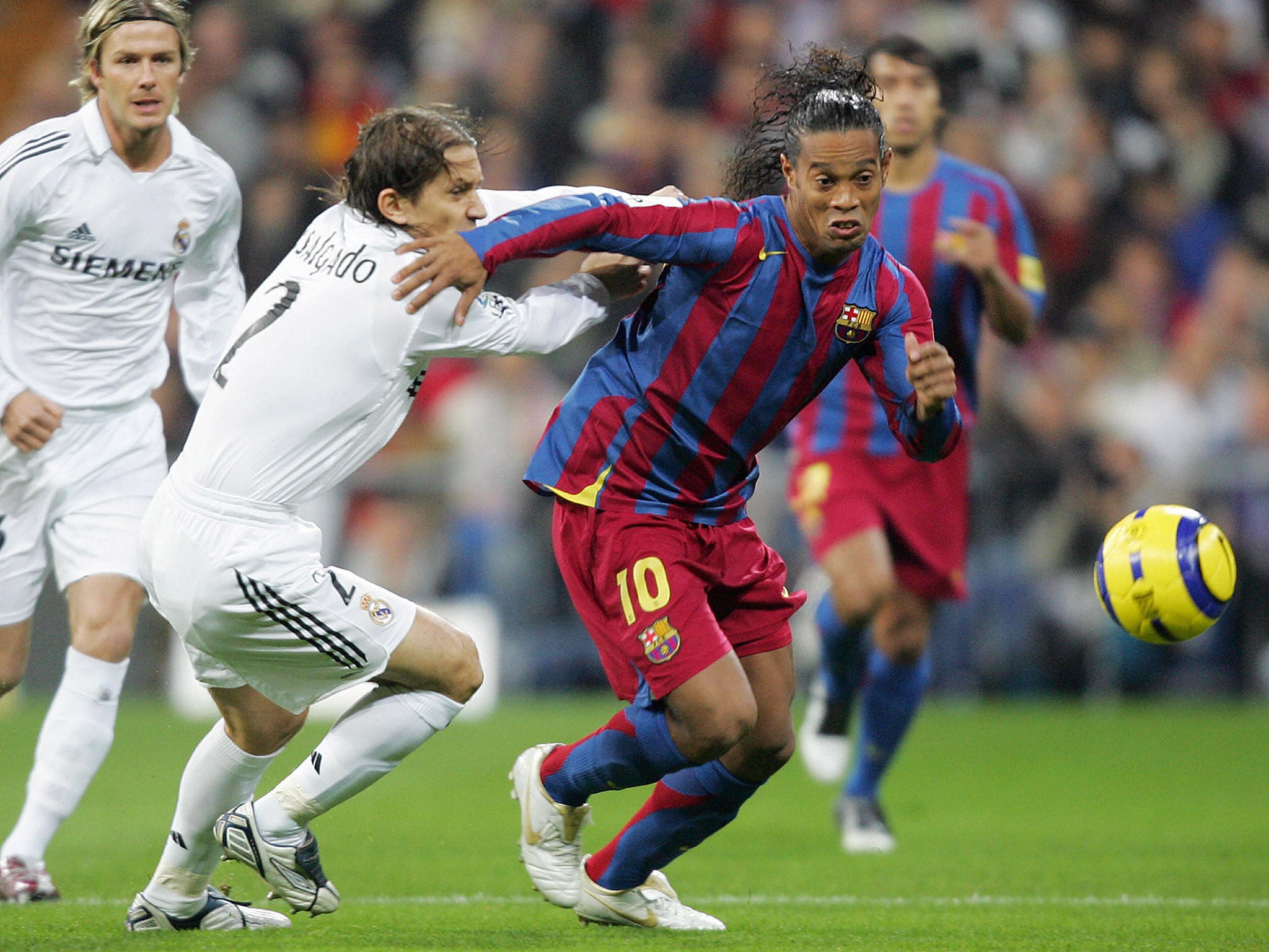 Ronaldinho scored twice in a 3-0 win over rivals Real Madrid