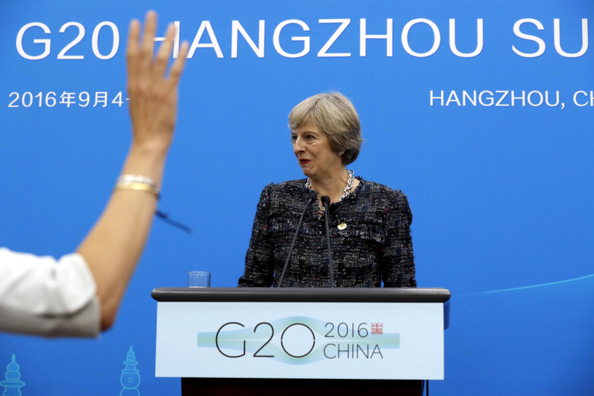 Theresa May prepares to take questions at a news conference held at the end of the G20 summit