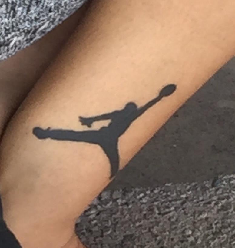 Perez, who is 6ft 3in tall, has a tattoo of the Nike Air Jordan logo behind his ear (North Las Vegas PD)