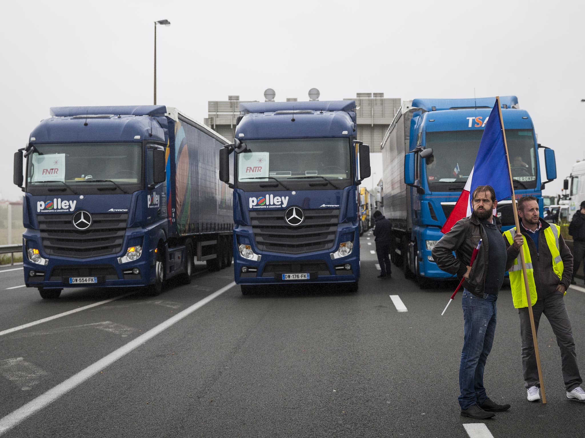 Lorries blockade the main road into the Port of Calais to protest against "The Jungle" refugee camp on 5 September, 2016