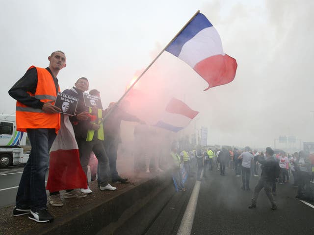 Protesters block the A16 highway around the port of Calais
