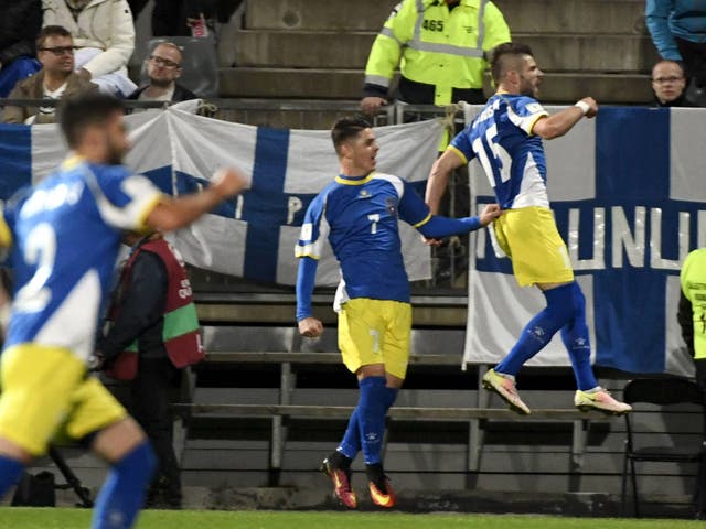 Valon Berisha leaps for joy after scoring the equalising penalty for Kosovo