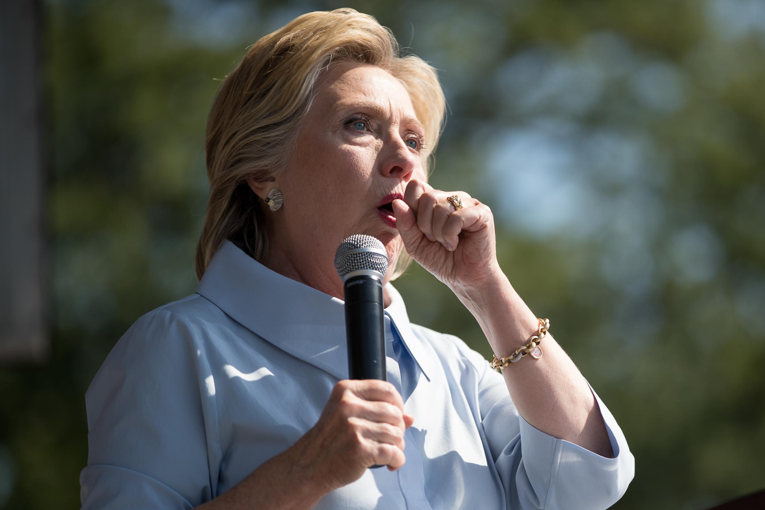 Hillary Clinton is hit by a coughing fit during her speech during a Labour Day festival at Luke Easter Park in Cleveland, Ohio