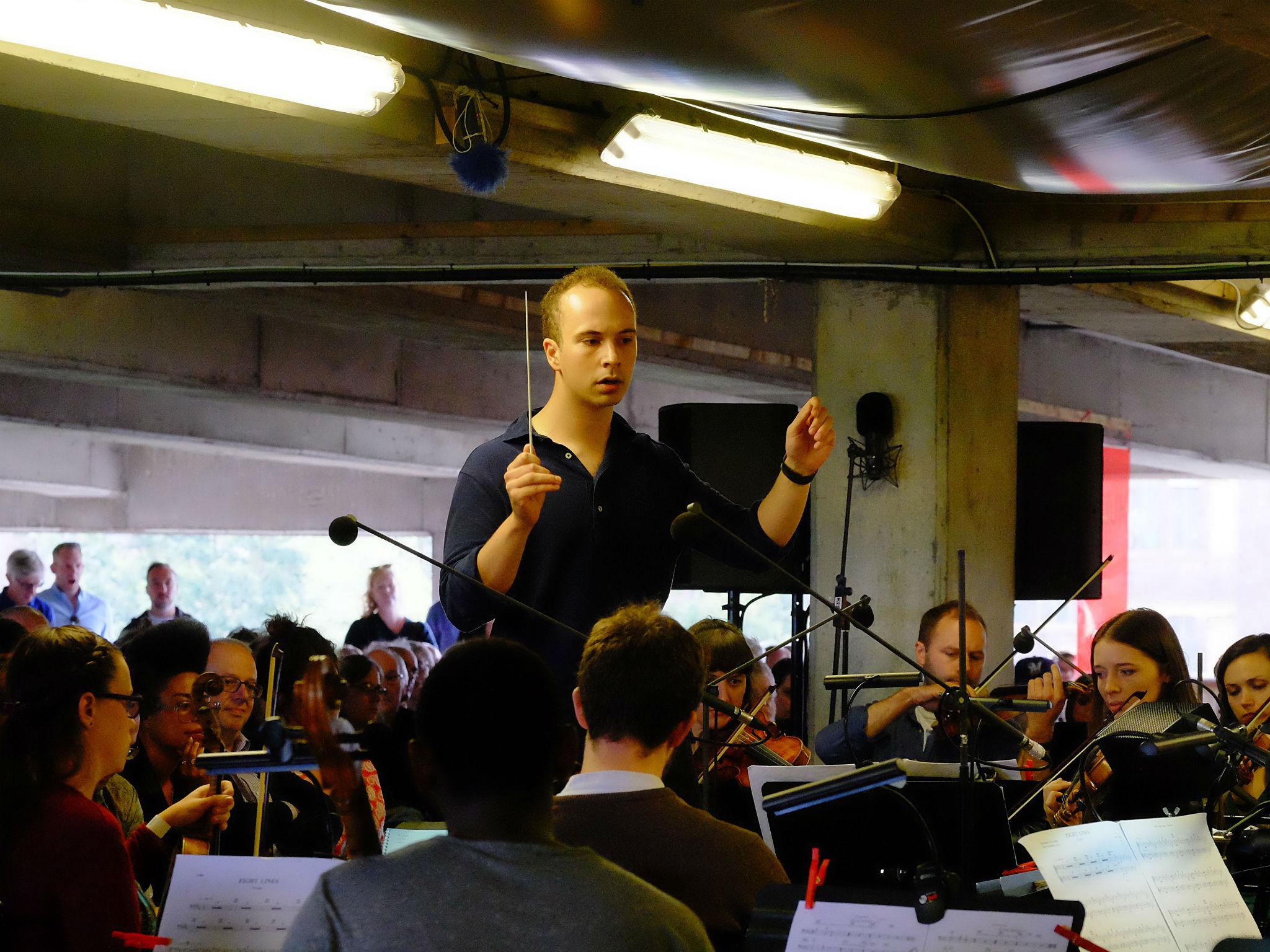 Christopher Stark conducts the Multi-Story Orchestra at the BBC Proms At…Bold Tendencies Multi-Storey Car Park in Peckham