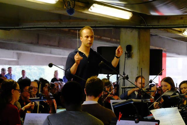 Christopher Stark conducts the Multi-Story Orchestra at the BBC Proms At…Bold Tendencies Multi-Storey Car Park in Peckham
