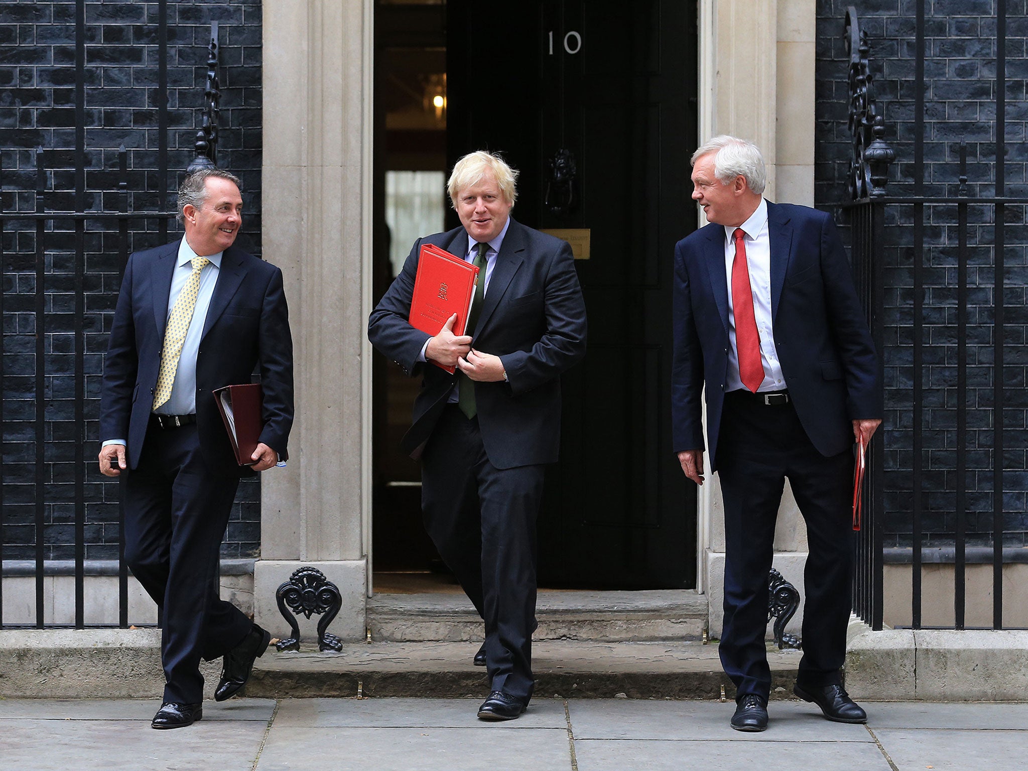 The ‘three Brexiteers’, including Mr Davis, right, leave Downing Street yesterday after a Cabinet meeting