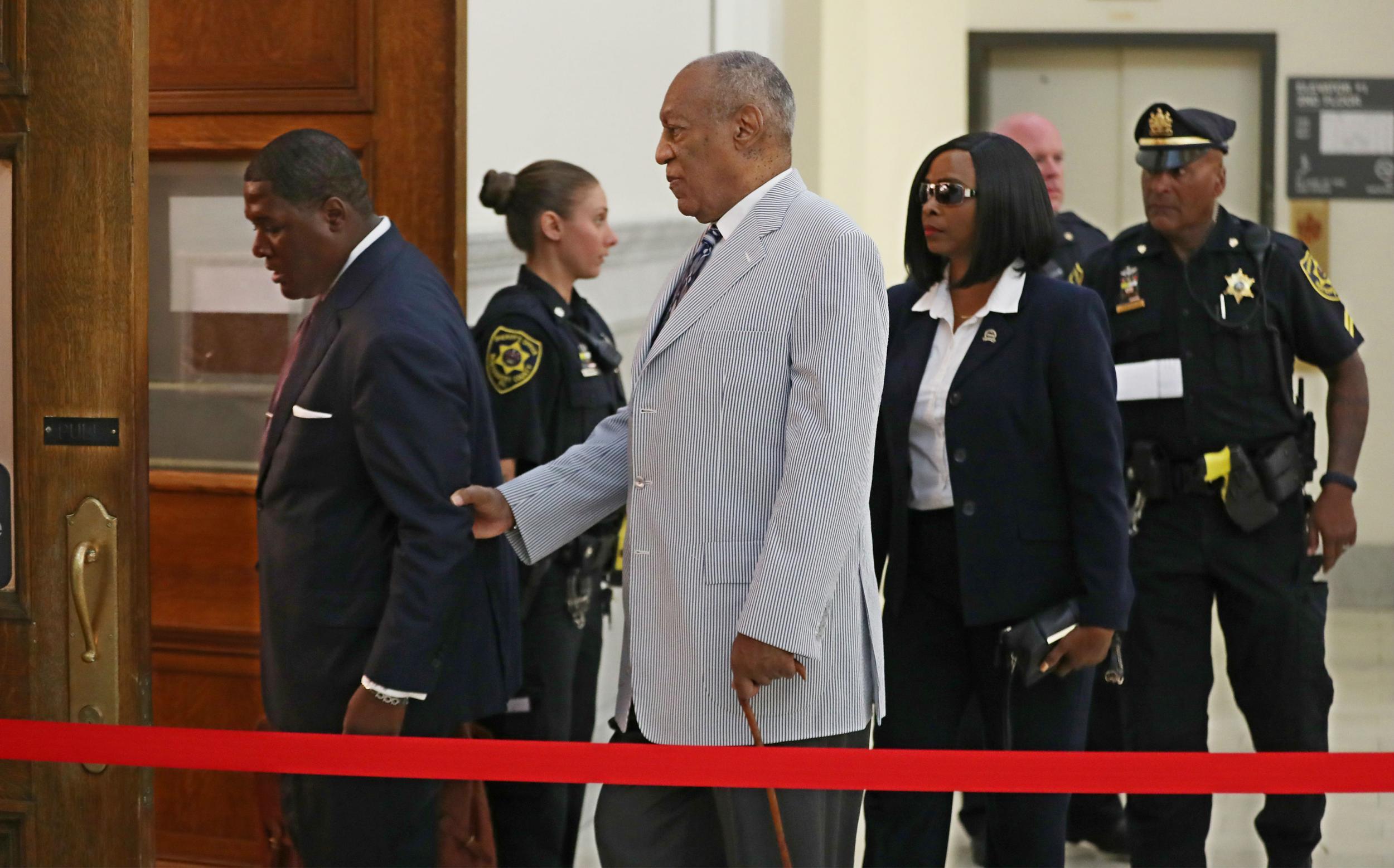 Bill Cosby is led into the court in suburban Philadelphia on Tuesday