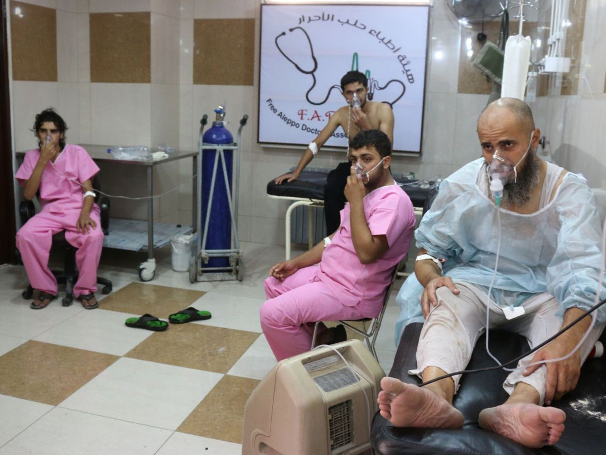 Syrians suffering from breathing difficulties in a make-shift hospital in Aleppo on 6 September