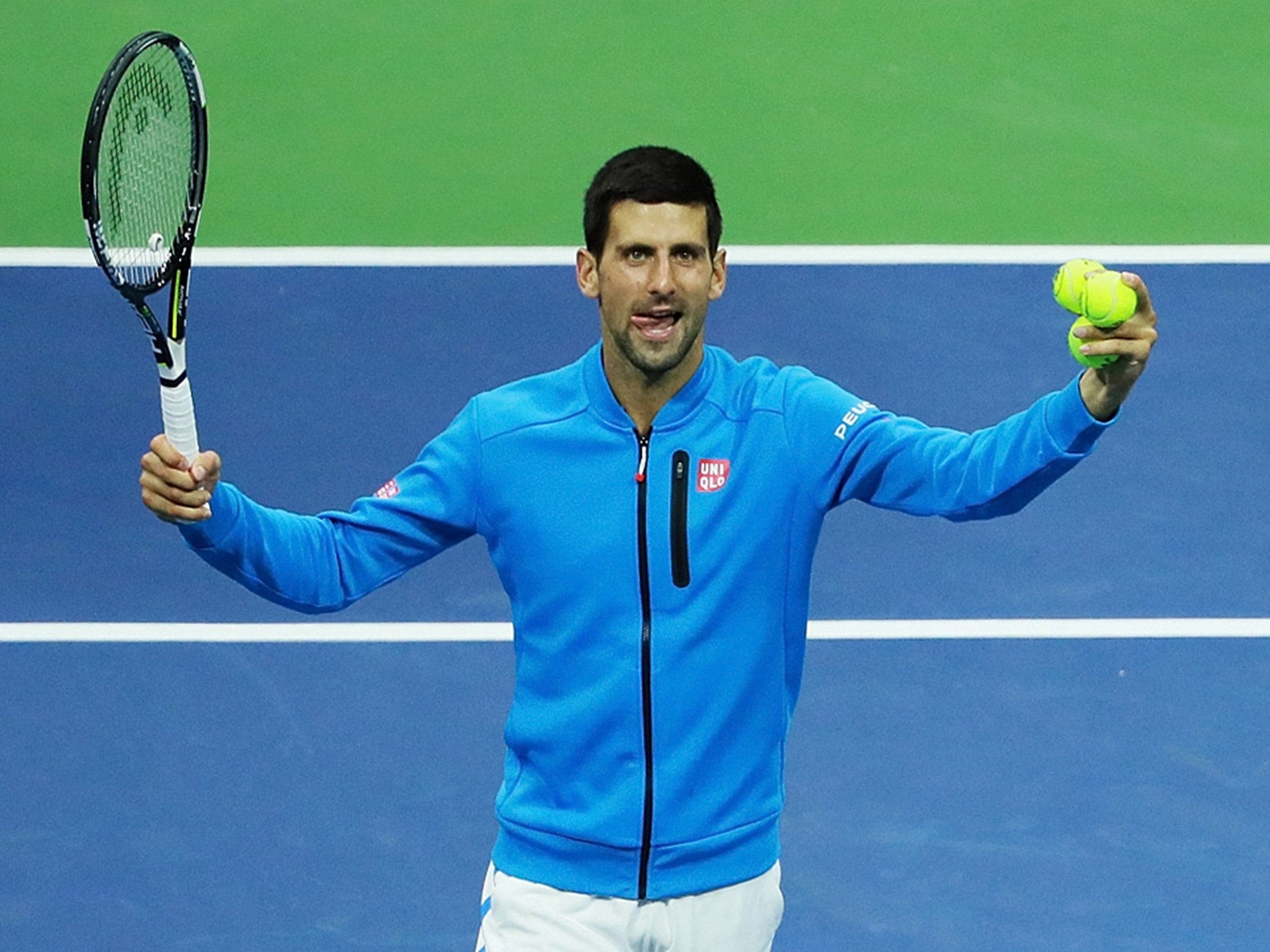 Novak Djokovic celebrates his walkover victory over Jo-Wilfried Tsonga