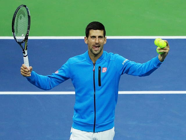 Novak Djokovic celebrates his walkover victory over Jo-Wilfried Tsonga