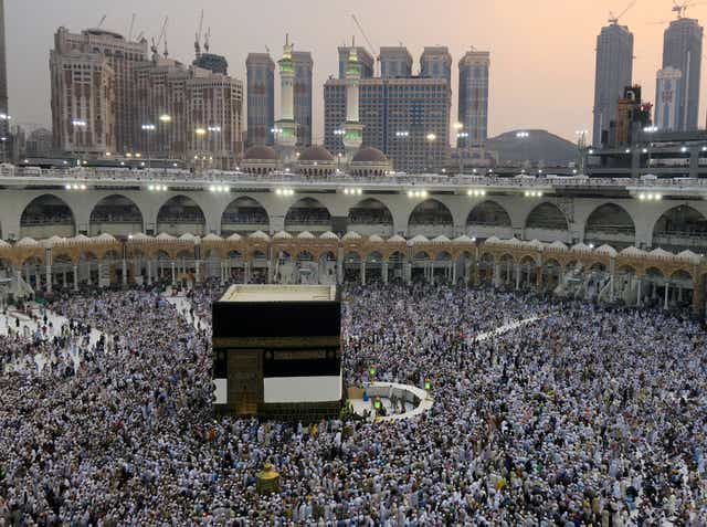 Muslim pilgrims circle the Kaaba at the Grand mosque in Mecca