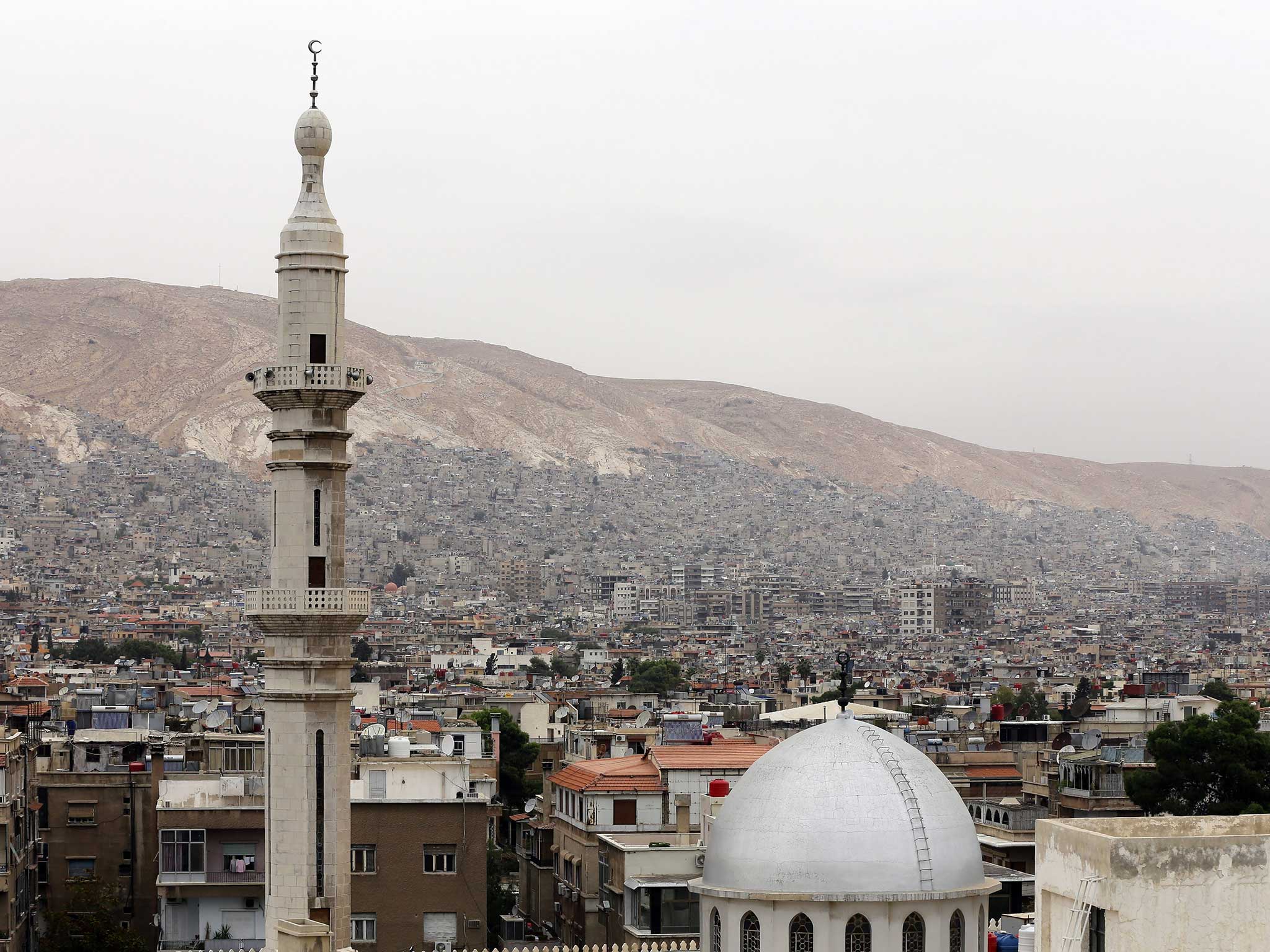 Mount Qasioun, said to be where Cain killed Abel, rises above the Syrian capital Damascus. Centuries on, the violence continues