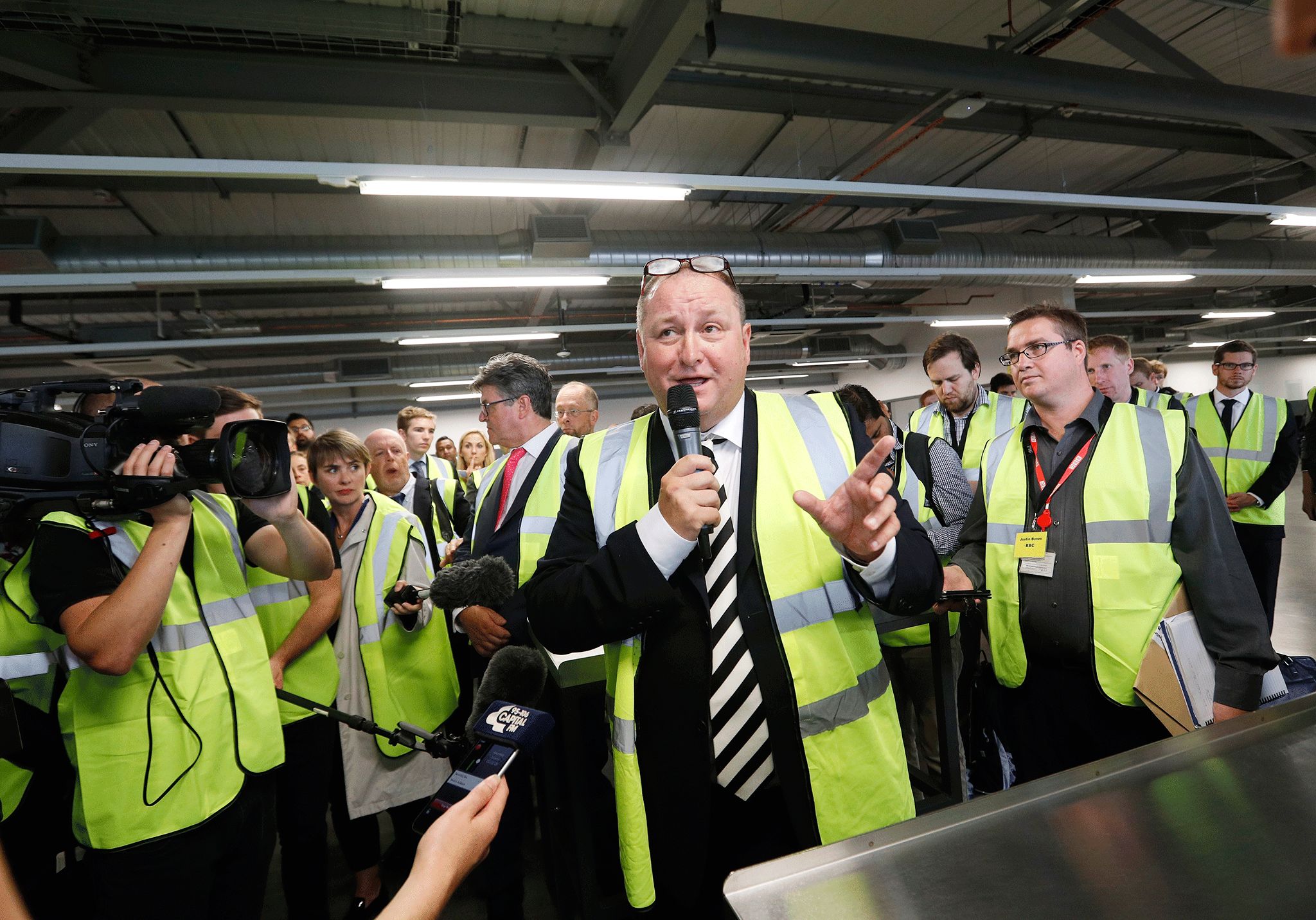 Mike Ashley talks to investors and journalists as he shows them round the company’s controversial Shirebrook plant after the company’s AGM.