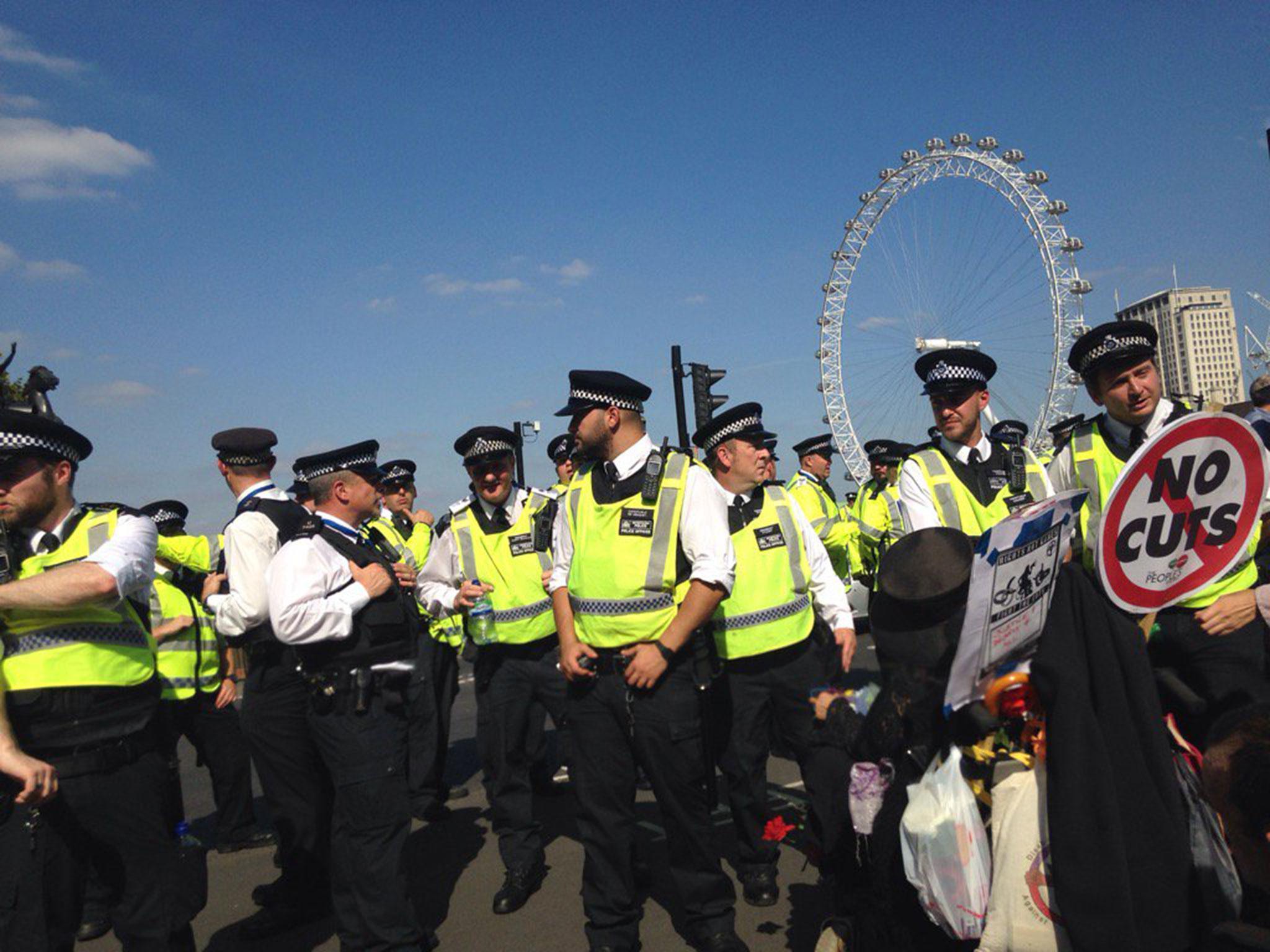 Police officers at the protest by Disabled People Against Cuts