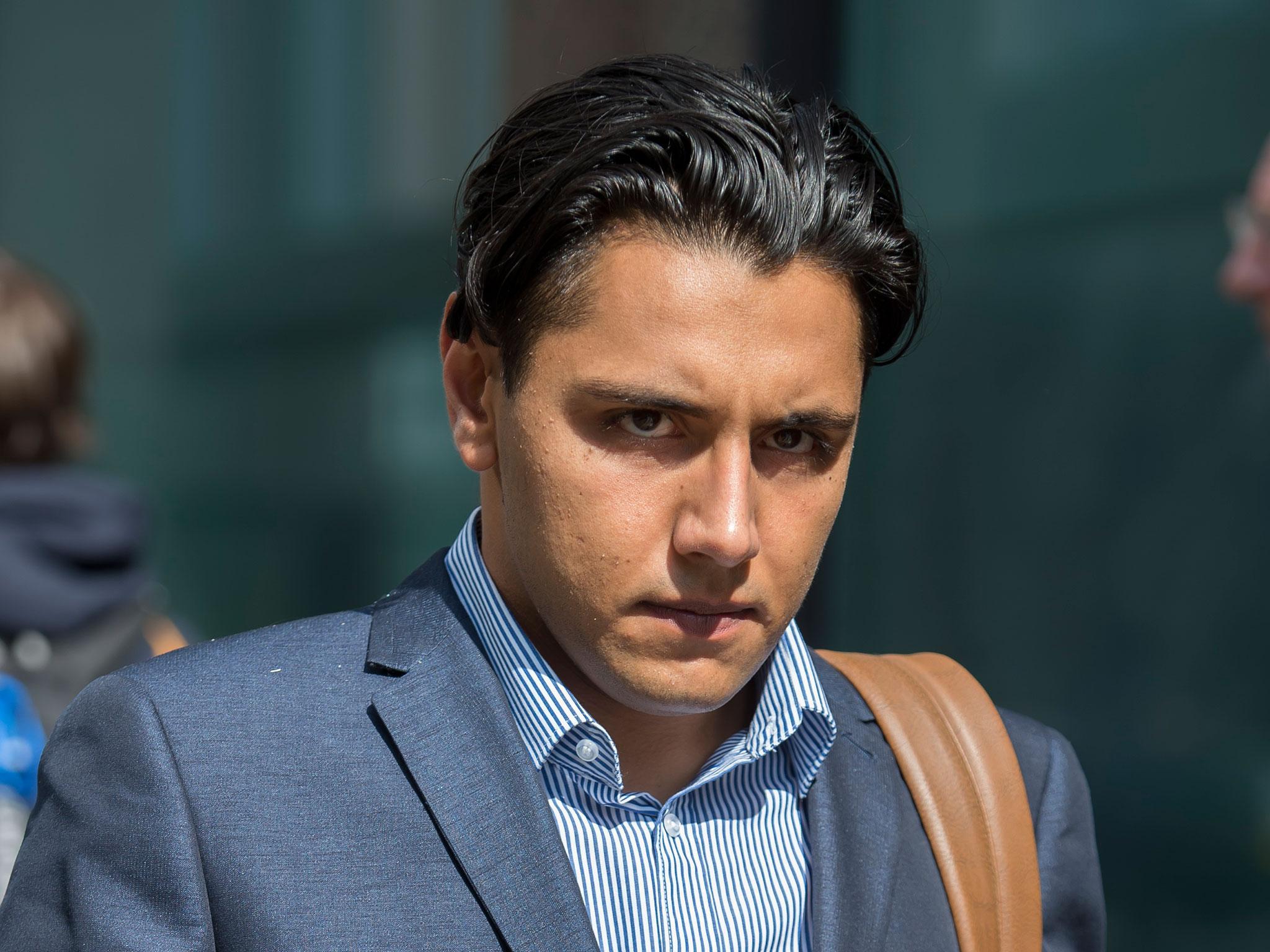 City trader Daniel Green, 26, leaves the Old Bailey in London where he denied raping a young woman