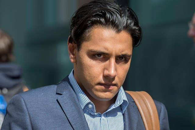 City trader Daniel Green, 26, leaves the Old Bailey in London where he denied raping a young woman 