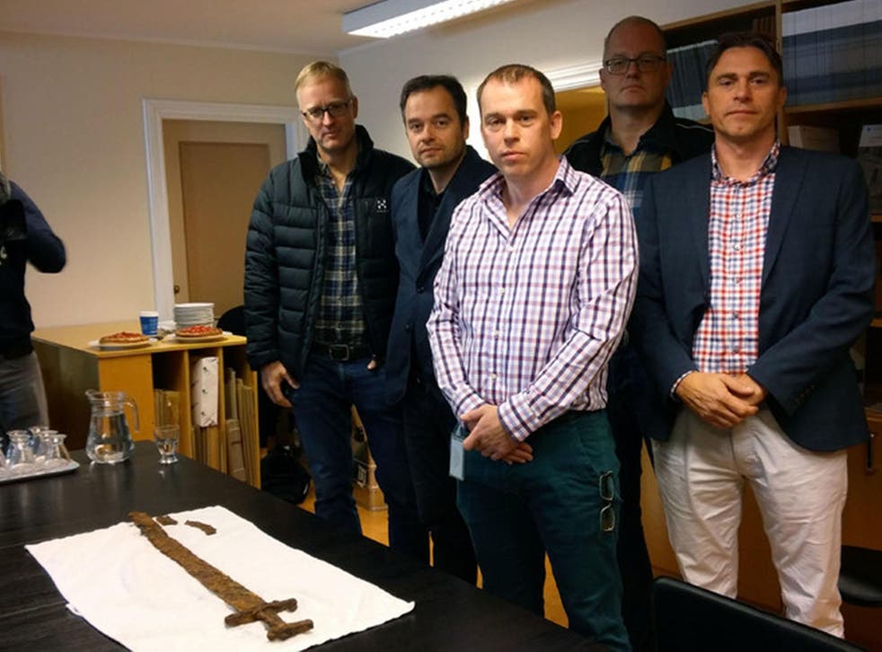 The group of five hunters with the rare preserved sword they found in Skaftárhreppur, south Iceland
