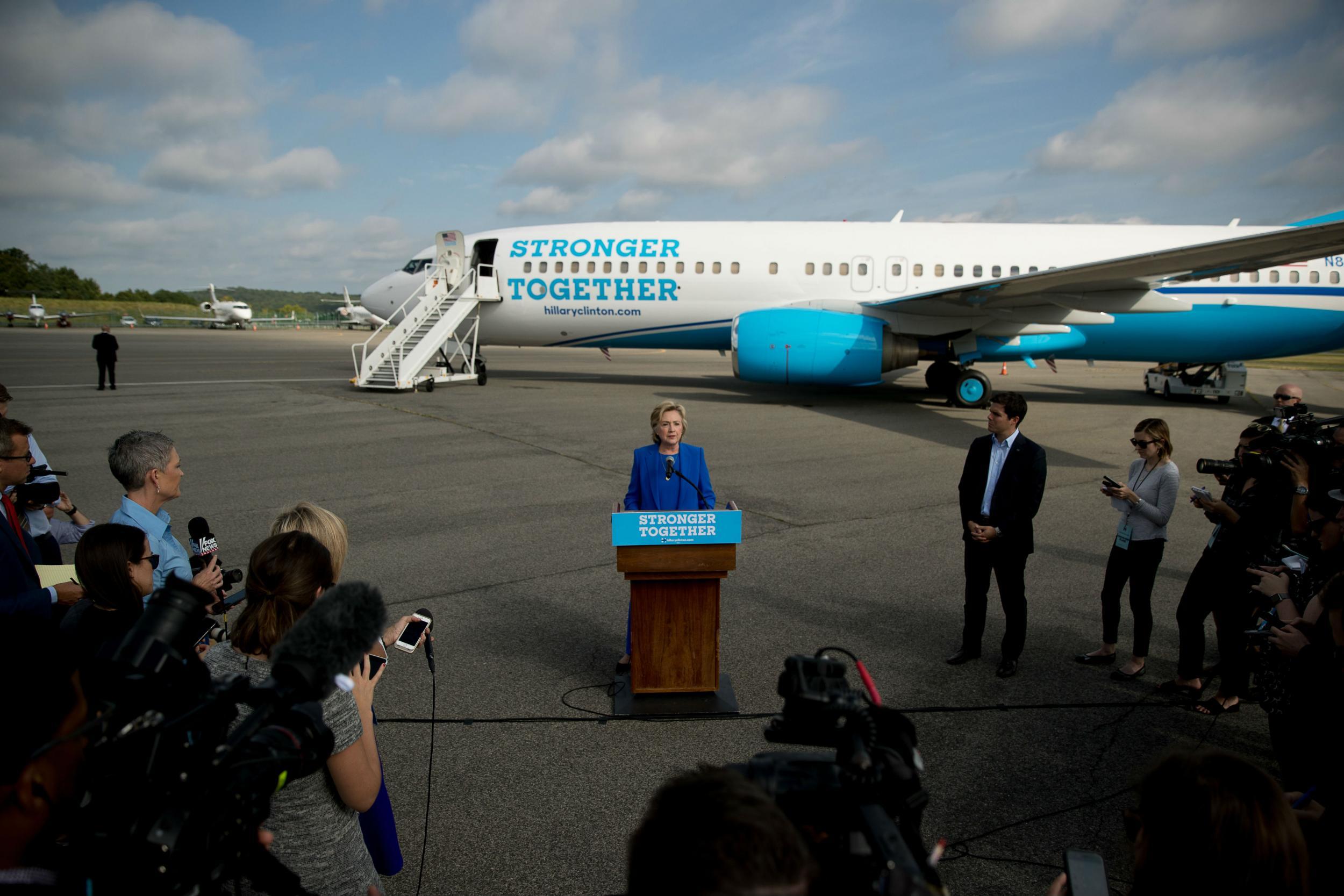Hillary Clinton blasts Donald Trump with her campaign plane behind her