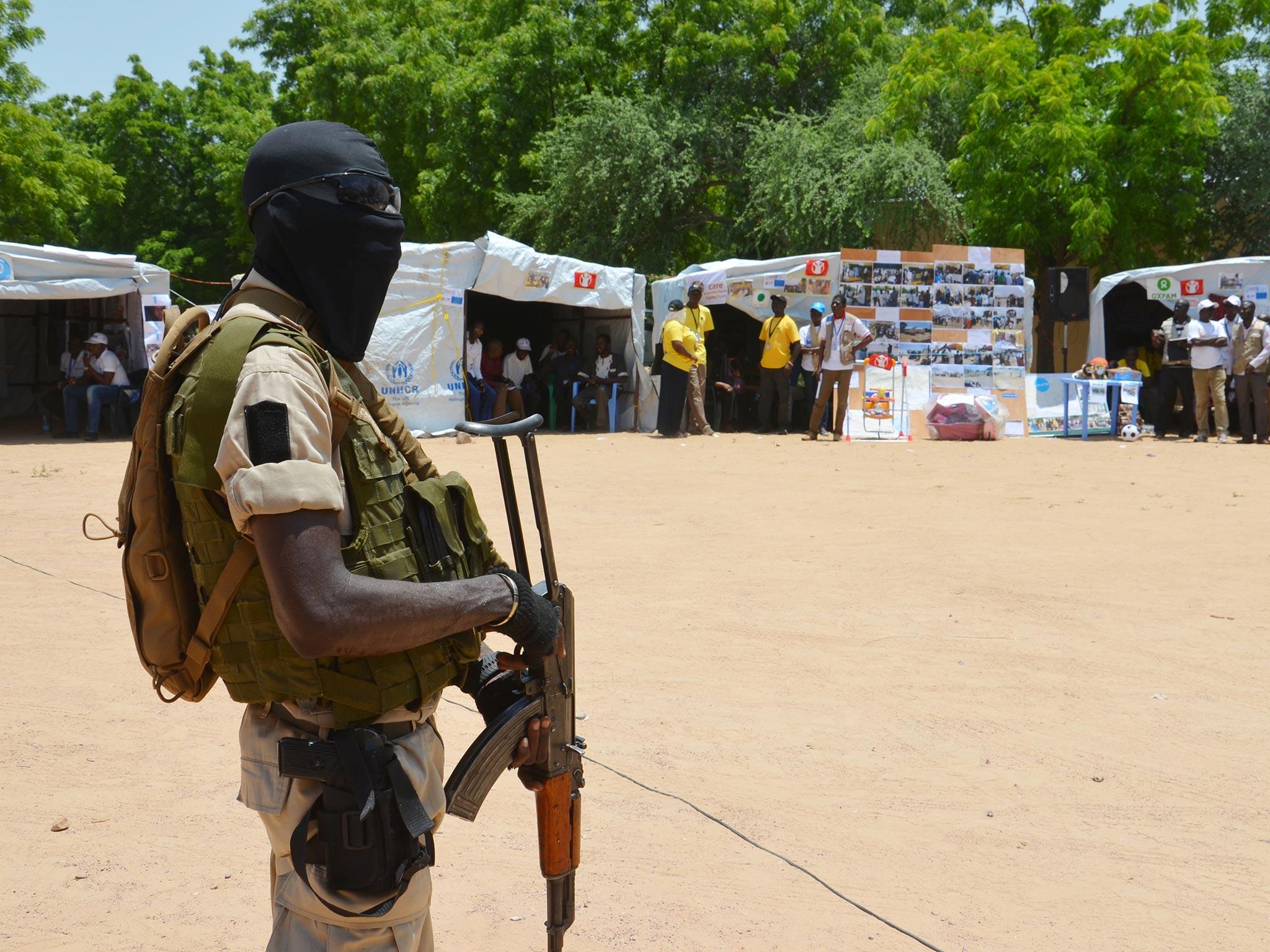 A soldier stands guard in a camp for some 300,000 refugees that have been internally displaced by the militant group