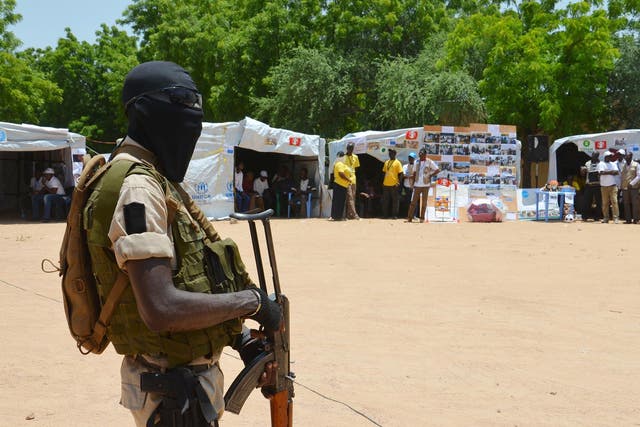 A Nigerian soldier stands guard in a camp for people displaced by Boko Haram