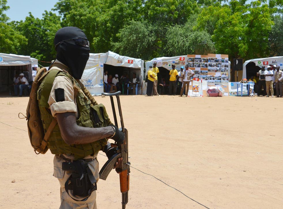 A Nigerian soldier stands guard in a camp for people displaced by Boko Haram